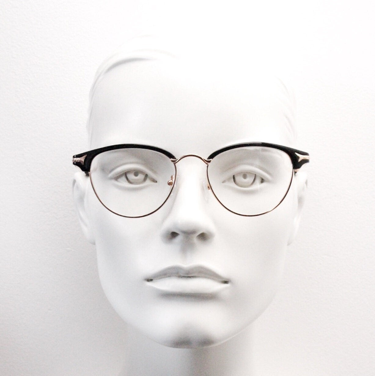 90s vintage browline cat eye glasses. Black gloss and gold half frame eyeglasses. 50s, 60s cateye design with clear lenses. NOS
