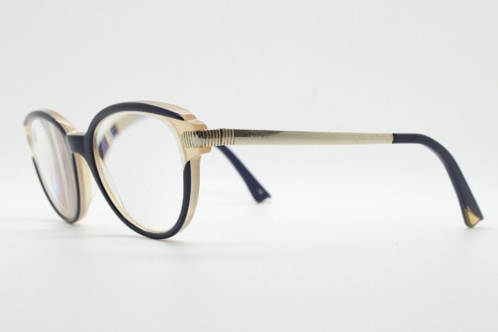 Nina Ricci vintage cat eye glasses. Yellow crystal and black acetate cateye optical frames gold metal arms. Womens prescription spectacles