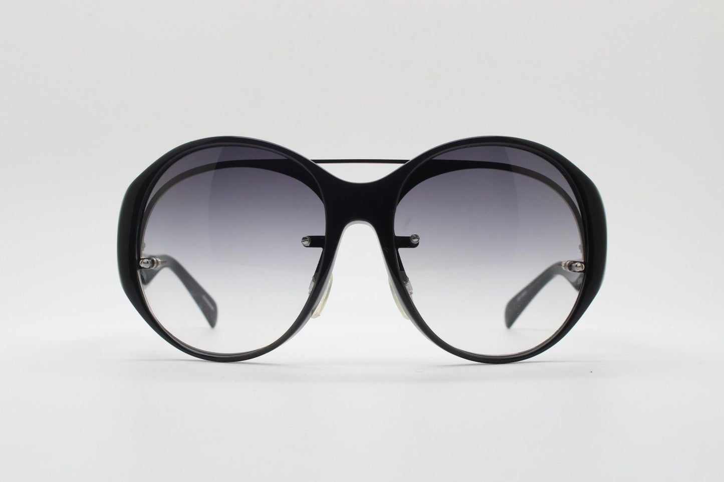 Jens Laugesen oversized sunglasses hand made by Linda Farrow. Black frame with undulating arms and smoky lenses. 70s design. Vintage. NOS