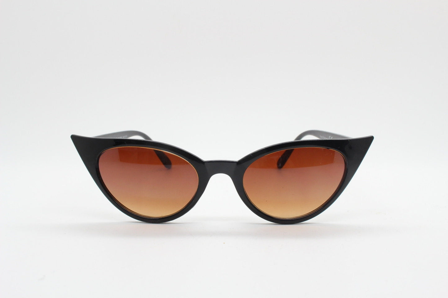 Y2K vintage pointed cat eye sunglasses. Womens black slender 50s style frame with Havana brown lenses. Rockabilly, bad girl pin up