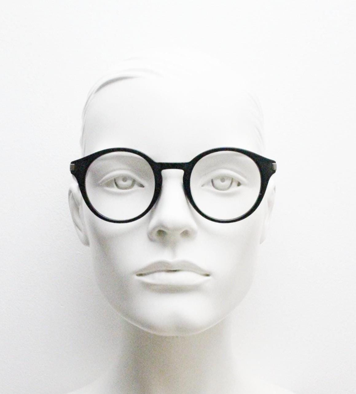 Marc Jacobs round eye glasses in plain black satin finish acetate. Strong fashion look optical frames. Prescription RX spectacles
