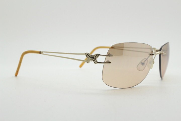 Y2K vintage rimless rectangular sunglasses. Frameless 2000's brown lens with slight mirror glaze gold trim and butterfly hinges. 00's NOS