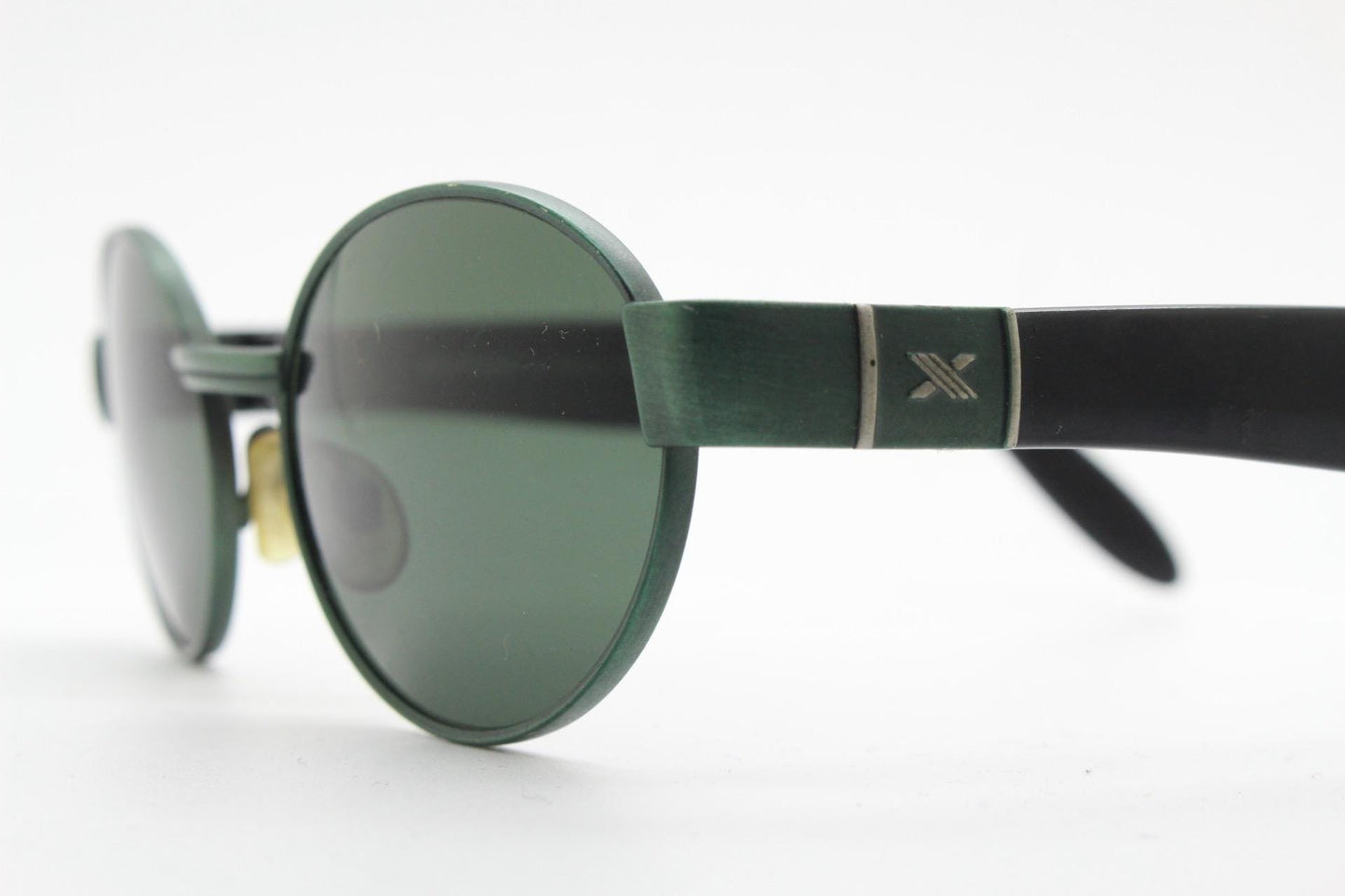 Safilo for Oxydo 90s vintage oval sunglasses made in Italy. Green matt finish solid metal frame with black arms and green lenses. Unused NOS