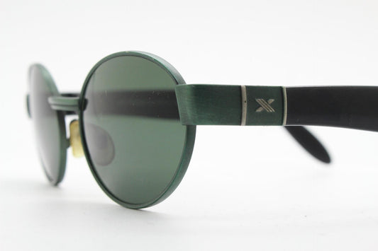 Safilo for Oxydo 90s vintage oval sunglasses made in Italy. Green matt finish solid metal frame with black arms and green lenses. Unused NOS