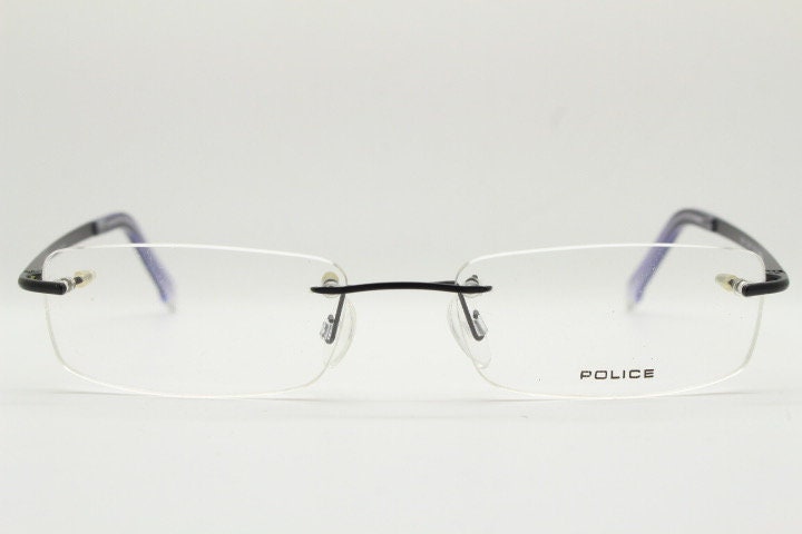 Police 90s vintage rectangular frameless eye glasses made in Italy. Minimal low profile optical frame with black satin metal trim. RX