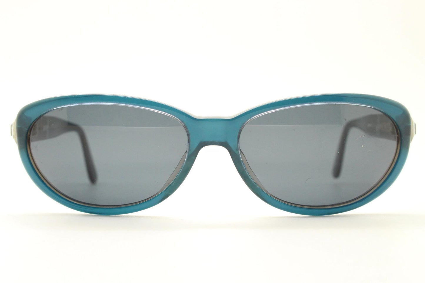Genny 90s vintage oval cat eye sunglasses made in Italy. Transparent deep blue acetate frame with matching lenses. Womens NOS cateye. BNWT