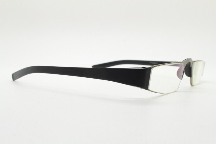 Porsche design rectangular eye glasses. Minimal grey metal optical frame in a matt finish with black arms. Vintage Prescription spectacles