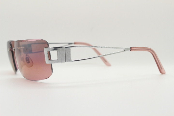 Y2K vintage rectangle frameless visor sunglasses. 2000's chrome trim wrap around with pink curved and bevelled lenses. 00's NOS