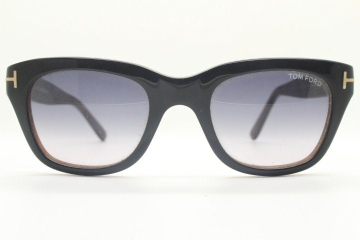 Tom Ford vintage modified wayfarer sunglasses made in Italy. Slightly cat eye form in black gloss acetate with superb graduating lenses