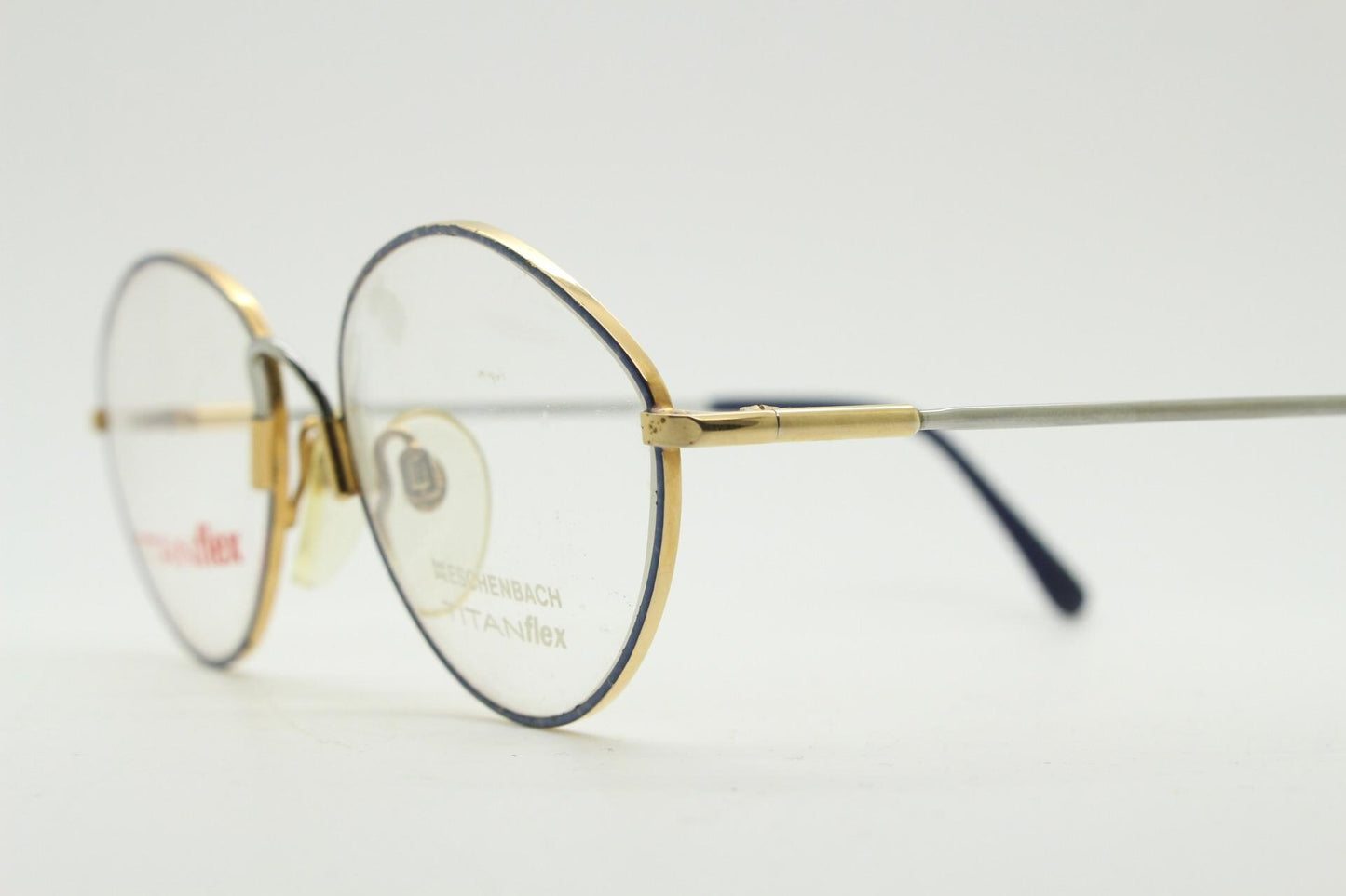 Eschenbach 90s vintage oval eye glasses made in Germany. Titanium optical frame with tasteful purple marbled front. Prescription NOS