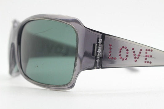 Polaroid Y2K vintage shield sunglasses. Transparent grey wrap around with red diamante LOVE logo and polarising lens. 2000s. Rhinestone