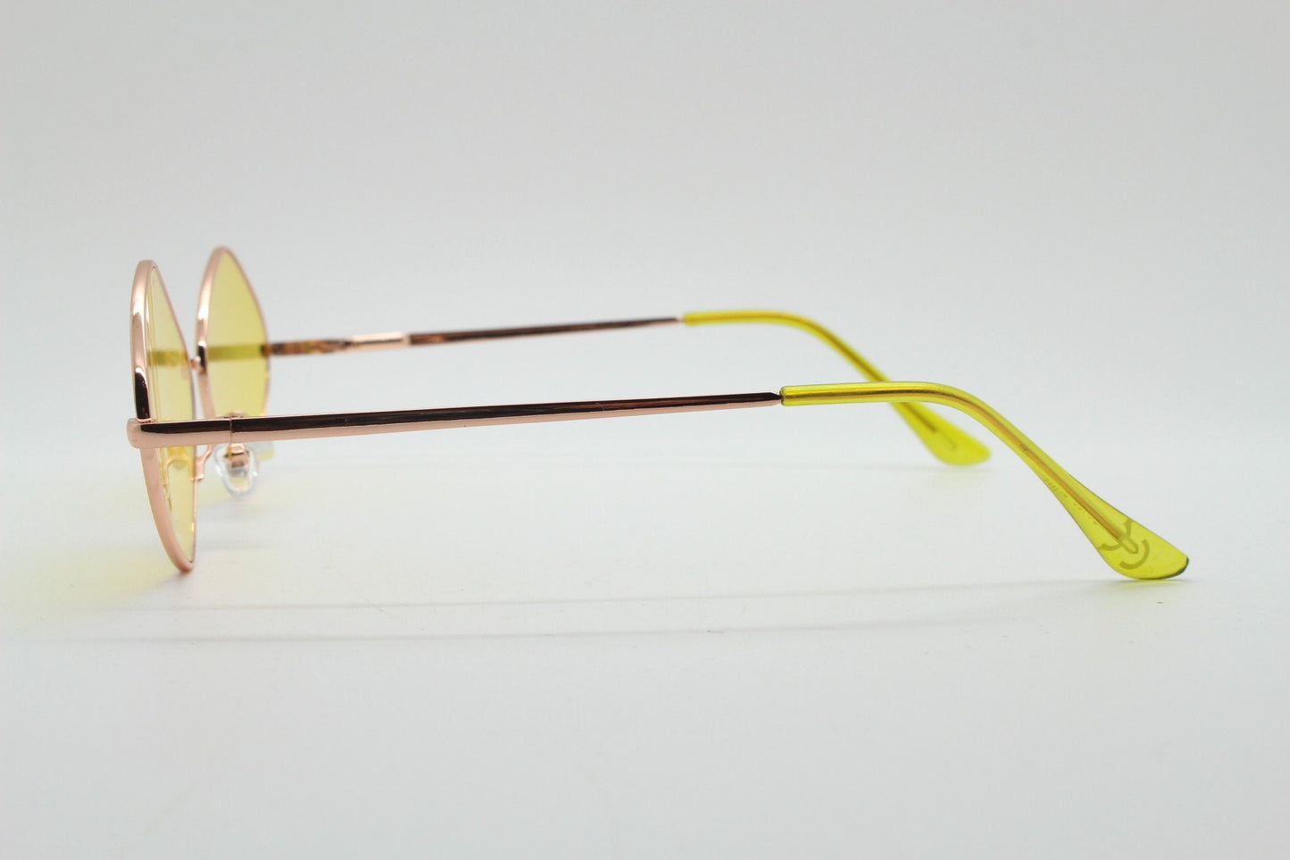 90s vintage diamond sunglasses. Minimal rose gold frame with psychedelic mod style yellow lenses. Unused BNWT