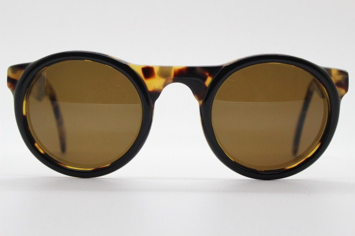 Francois Pinton Paris 90s vintage round sunglasses made in France. Womens thick acetate frame in honey tortoise brown tones. NOS