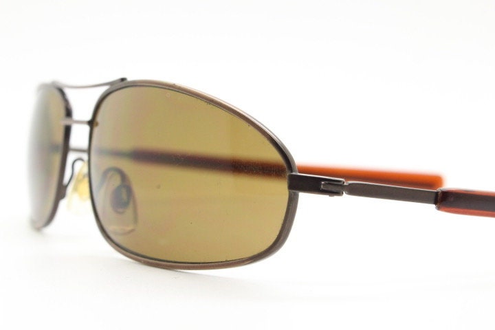 90s vintage abstract rectangular sunglasses. Metallic bronze satin finish frame with brown lenses and straight arms. 2000's. NOS aviator