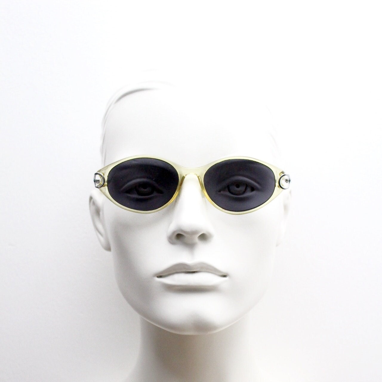 Carven Paris 90s vintage oval sunglasses. Womens transparent yellow frame with black lenses and silver metal arms. NOS