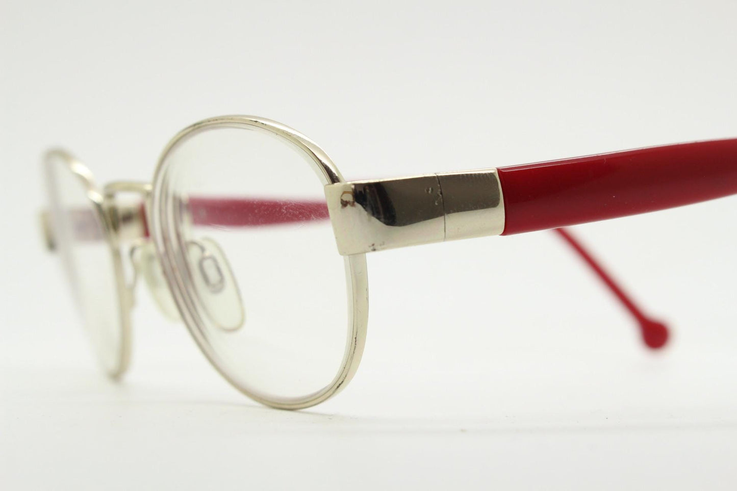 Red or Dead Y2K vintage oval eye glasses. Green or red interchangeable arms on a chrome metal frame. Optical prescription eyeglasses. RX