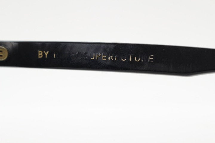 Retrosuperfuture thick flat top cat eye sunglasses hand made in Italy. All black gloss acetate frame. Vintage