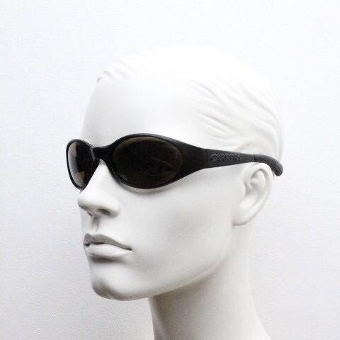 Carrera 90s vintage shield sunglasses made in Italy. Aerodynamic brown wrap around sport frame with big spell out logo. Bug eye. BNWT. NOS