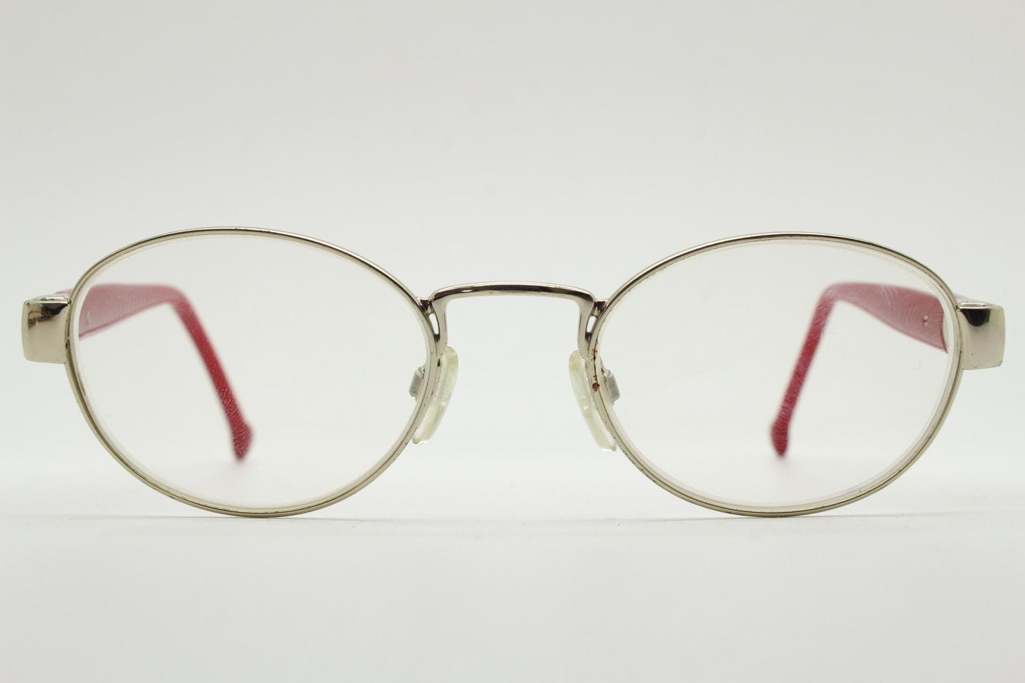 Red or Dead Y2K vintage oval eye glasses. Green or red interchangeable arms on a chrome metal frame. Optical prescription eyeglasses. RX