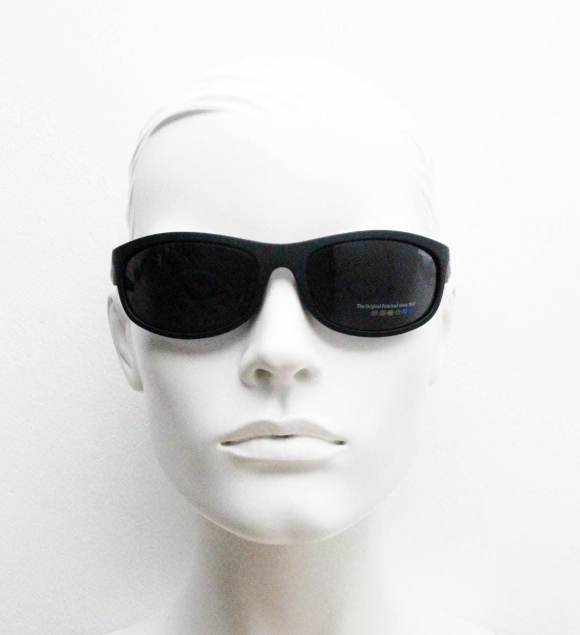 Polaroid vintage sports shield sunglasses. Black rubber finish curved wrap around frame with polarising lenses. 2000s. Y2K. Bug eye. NOS