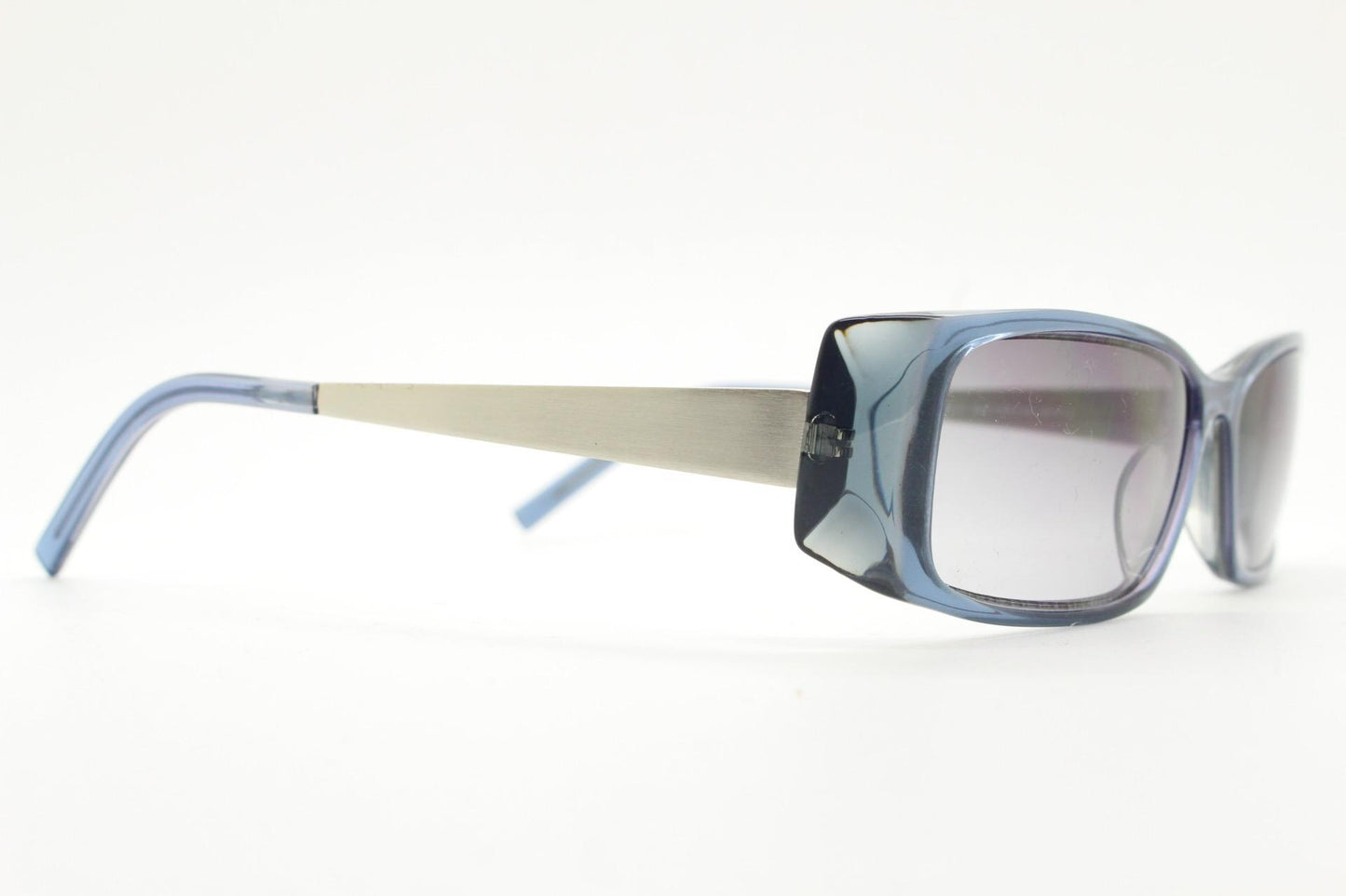 90s vintage rectangular low profile sunglasses by Storm. Transparent grey acetate front with brushed steel arms. NOS. 2000s