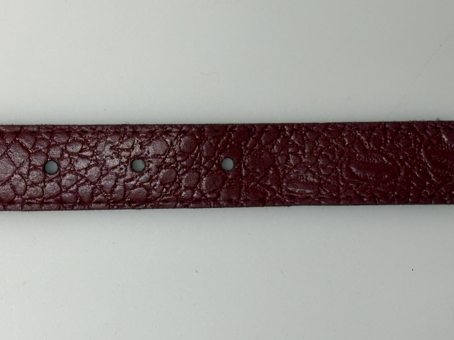 80s vintage womens embossed crocodile pattern 1" belt for jeans or trousers. Eco leather red vinyl with silver chrome buckle. Vegan