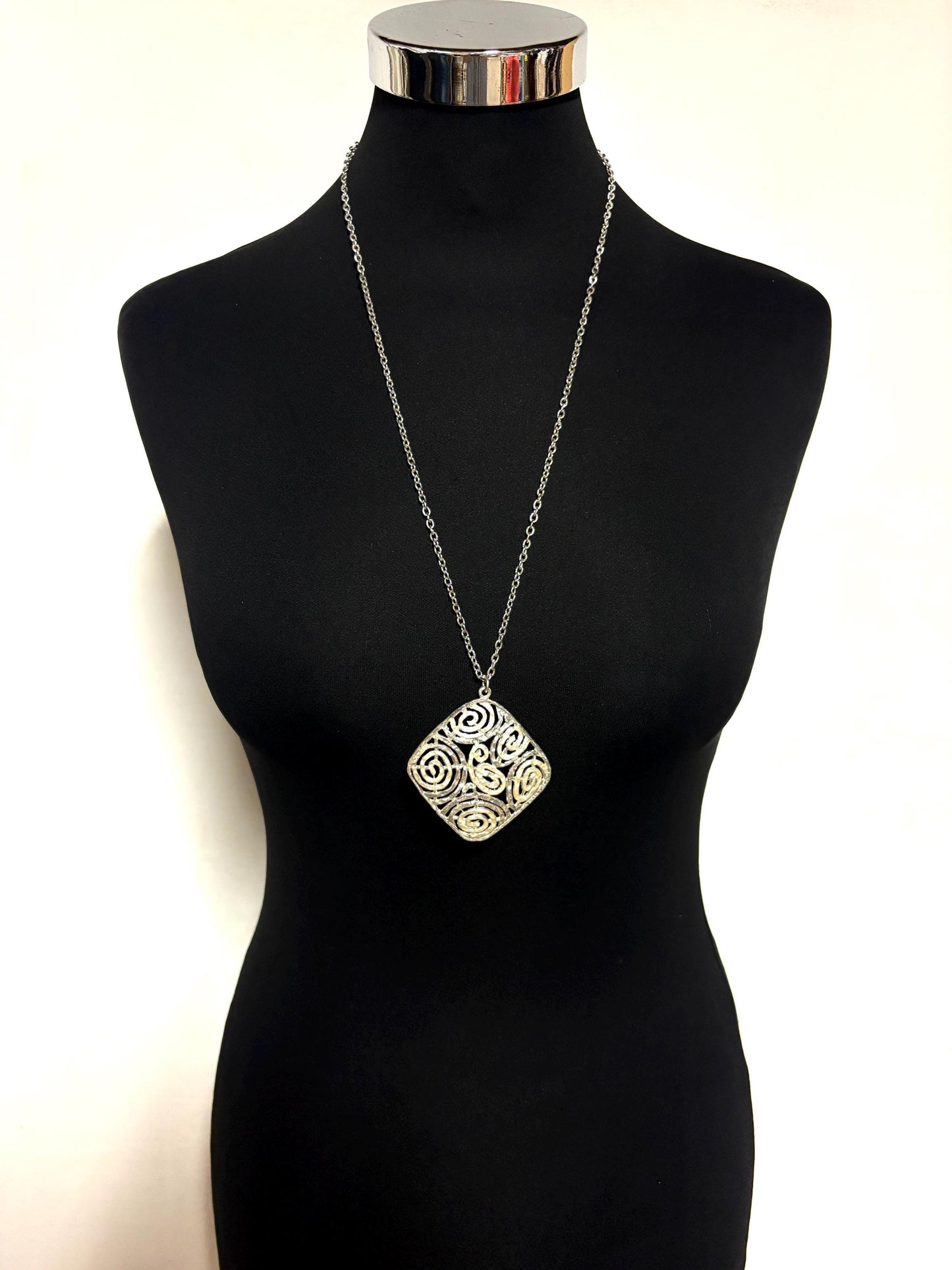 60s vintage large silver square pendant necklace made in England. Satin and matt finish with swirling paisley cut out shapes. Womens. NOS