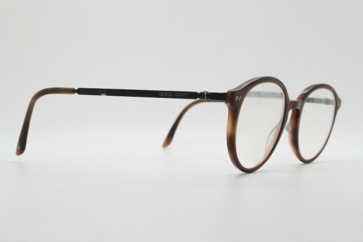 Giorgio Armani eye glasses model 7124 made in Italy. Mottled brown acetate optical frames with flat metal arms. Prescription eyeglasses. RX