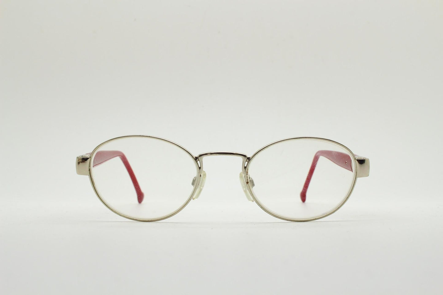 Red or Dead Y2K vintage oval eye glasses. Green or red interchangeable arms on a chrome metal frame. Optical prescription eyeglasses. RX