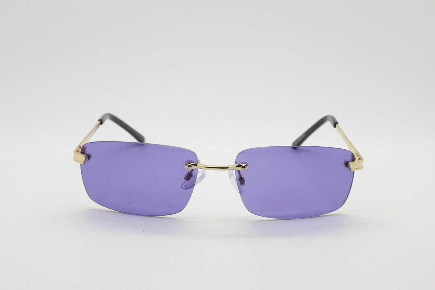 Y2K vintage frameless purple sunglasses. Rectangular lenses with gold bridge and arms. 2000s club kids. 00's. 90s Rave