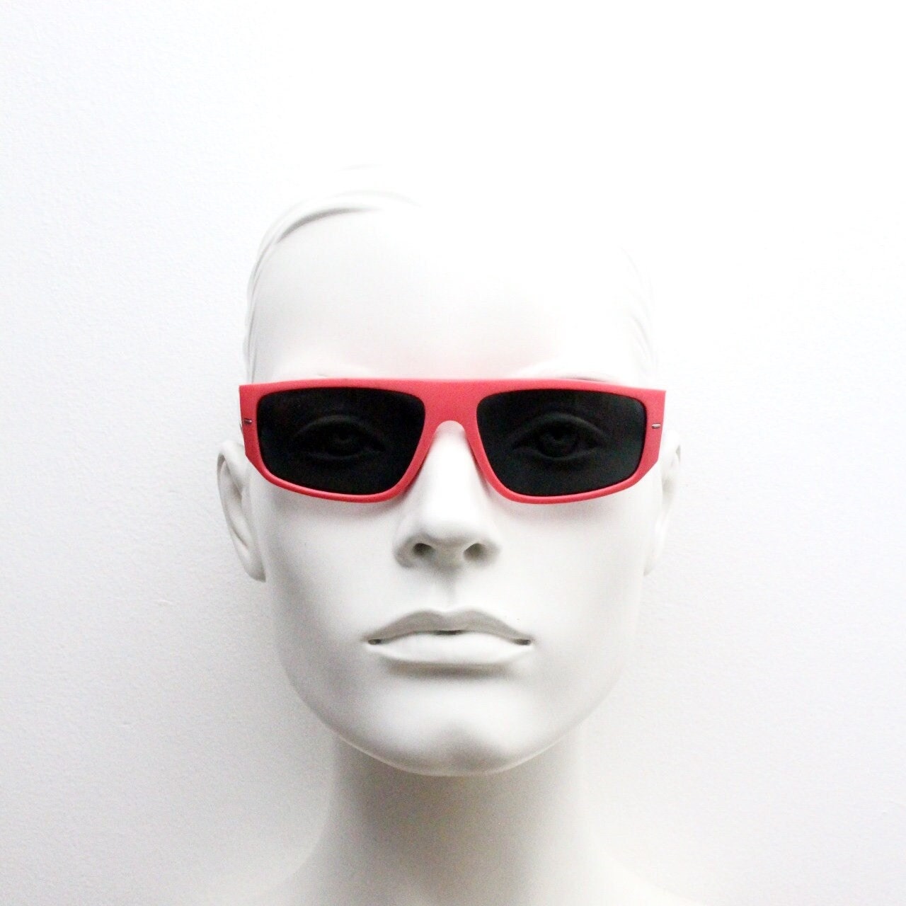 80s vintage 2 tone sunglasses. Aerodynamic flat top shield style wrap around frame in pink and black with real glass lenses. Unused NOS