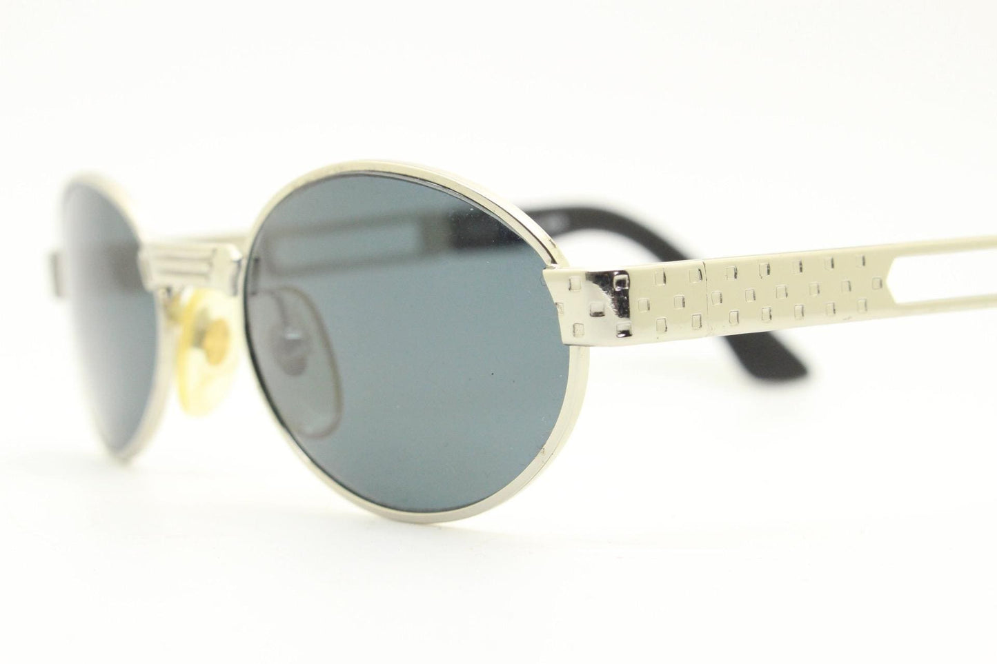 Prestige 90s vintage oval small bug eye sunglasses model 4028 made in Italy. Chrome finish solid metal frame with indented arm pattern. NOS