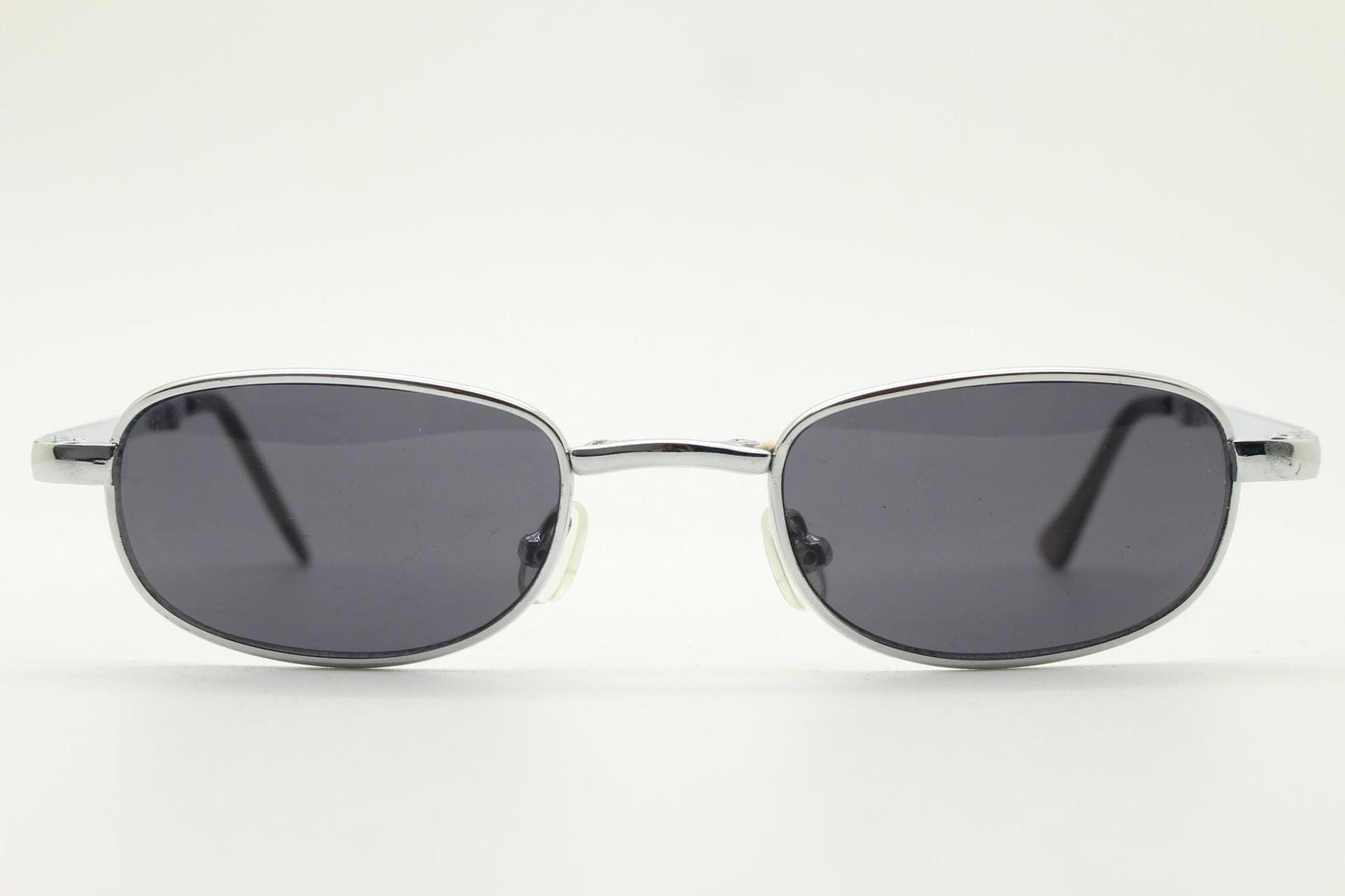 90s micro foldable rectangular sunglasses. Dark grey lenses in a small chrome folding compact frame. Folder. Rave 2000s. Y2K NOS