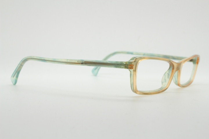 Alain Mikli rectangular eye glasses hand made in France. Low profile slim peach and blue transparent acetate optical frame. Prescription RX.