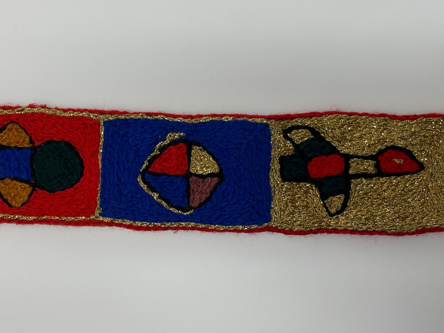 60s vintage completely hand made knitted belt. Embroidered sun, bird and abstract symbols with leather laced tie. Womens unique one off