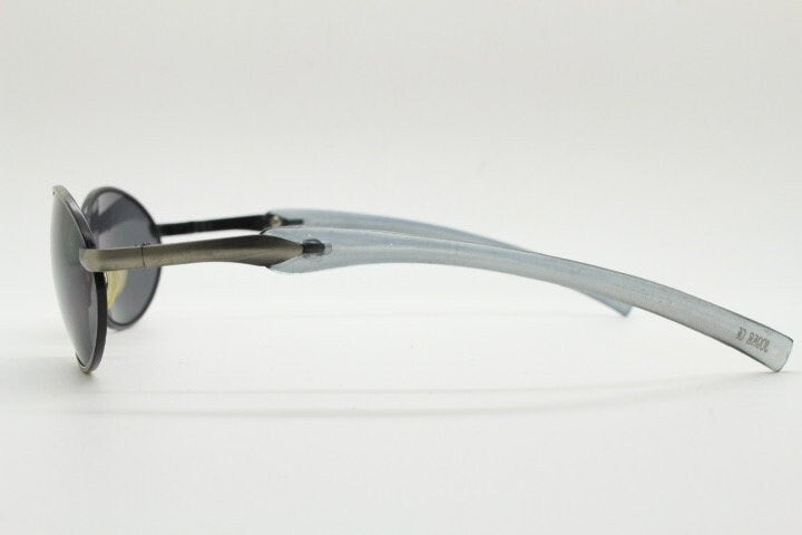 90s vintage small oval  bug eye sunglasses. Brushed bronze finish frame with transparent grey arms. Y2K. 2000s. Unworn NOS