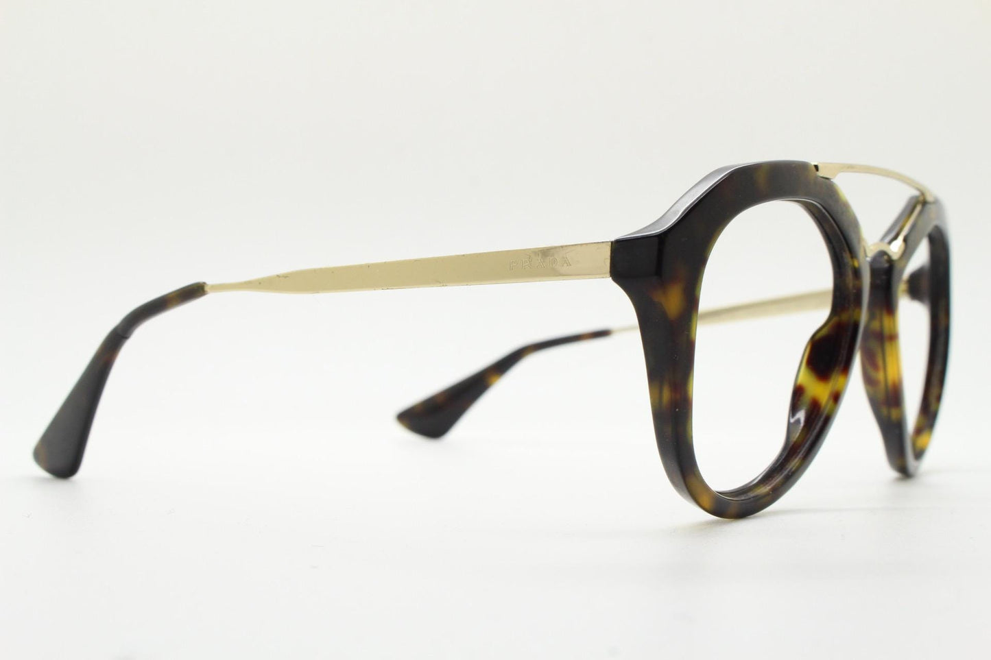 Prada angular eye glasses made in Italy. Thick tortoise acetate optical frames with prominent gold double bridge. Prescription. RX