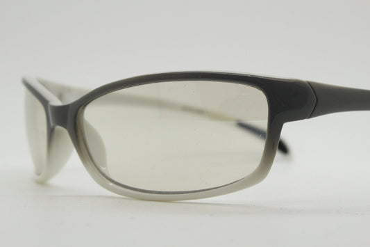 Y2K vintage futuristic sunglasses. Gloss white and grey wrap around shield style frame with light tone lenses. Cosplay visor. 2000s NOS