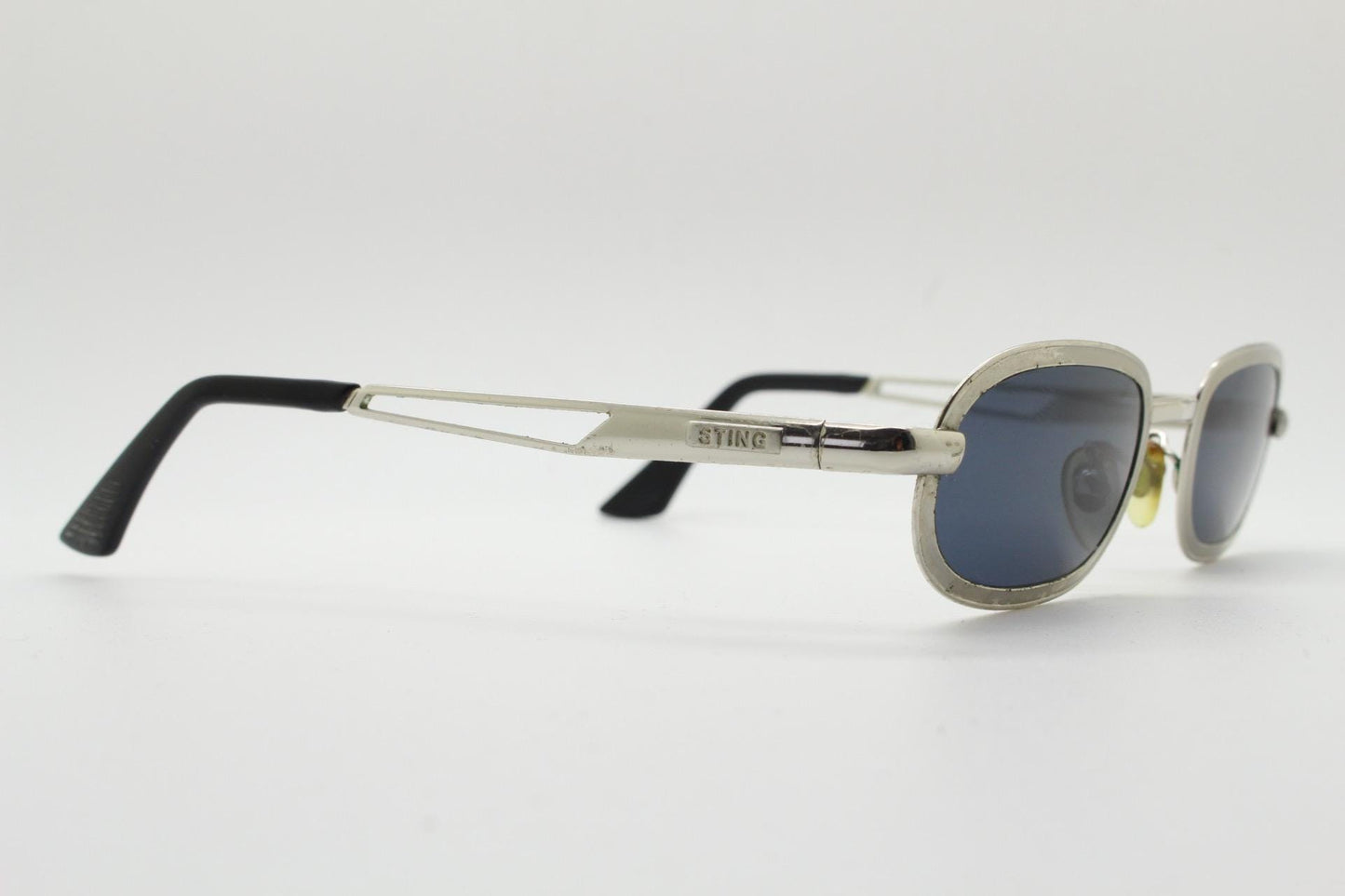Sting 90s vintage oval sunglasses. Minimal 'Industrial tech' style in slightly small proportions that's quirky but in a quality finish