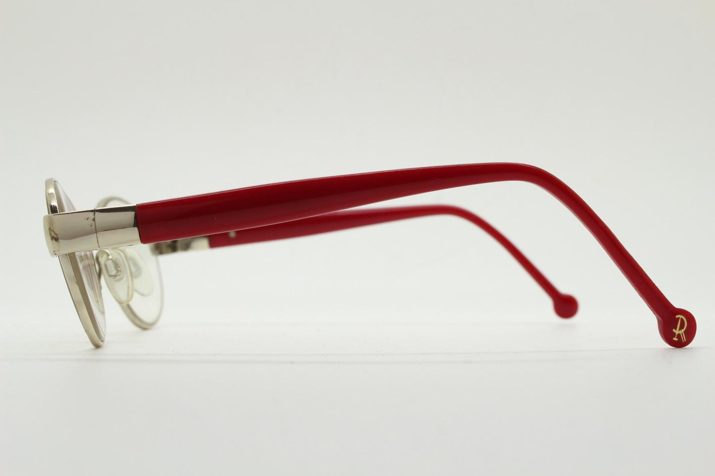 Red or Dead Y2K vintage oval eye glasses. Green or red interchangeable arms on a chrome metal frame. Optical prescription eyeglasses. RX