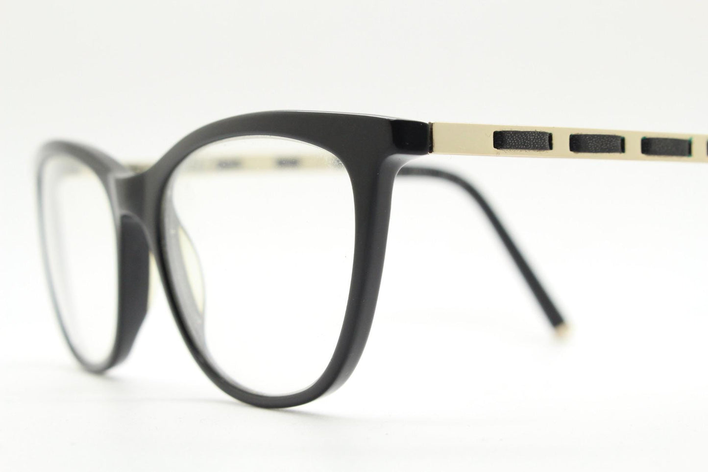 Vintage elegant cat eye glasses by Heritage. Black gloss acetate optical frames with leather lattice arms. Prescription RX cateye spectacles
