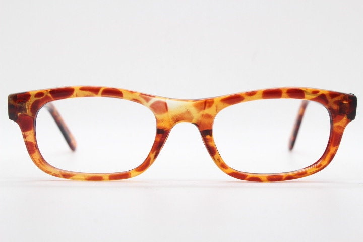 90s vintage rectangular low profile eye glasses. Transparent optical frame with vibrant amber giraffe pattern. Prescription eyeglasses. RX