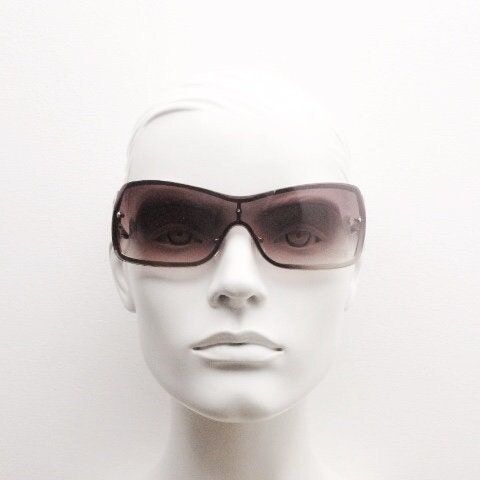 Y2K vintage visor sunglasses. 2000's brown wraparound mono lens mini mask shield design with stupendous lattice arms. Bug eye. Unworn NOS