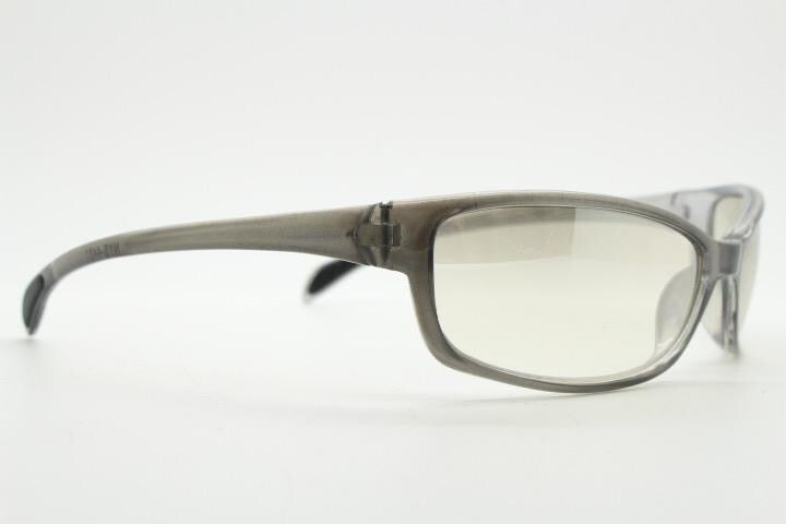 Y2K vintage futuristic sunglasses. Gloss white and grey wrap around shield style frame with light tone lenses. Cosplay visor. 2000s NOS