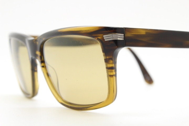 Oliver Peoples vintage rectangular sunglasses model Maceo. Handsome transparent mottled honey brown acetate frame with mid tone lenses
