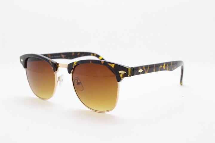 90s vintage browline sunglasses. All time classic design in tortoise gloss with gold half rim. 50s, 60s. Unused NOS