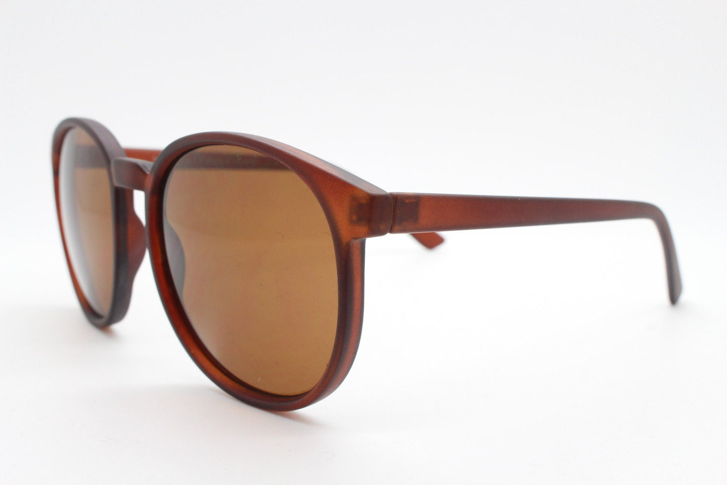 80s vintage round sunglasses. Slightly oversized slim transparent brown frame in a rubber finish with matching lenses. BNWT