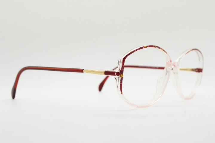 Silhouette 80s vintage hexagon eye glasses made in Austria. Transparent crystal optical frame with abstract red pattern. Prescription RX