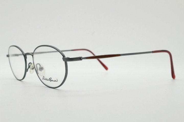 Eddie Bauer 90s vintage oval eye glasses.Grey matt finish optical frames with subtle brown trim. Prescription RX spectacles. NOS
