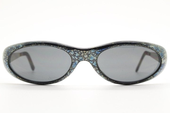 Killer Loop Shedevil 90s vintage shield sunglasses made in Italy. Low profile wrap around design with unique metallic print. One off sample